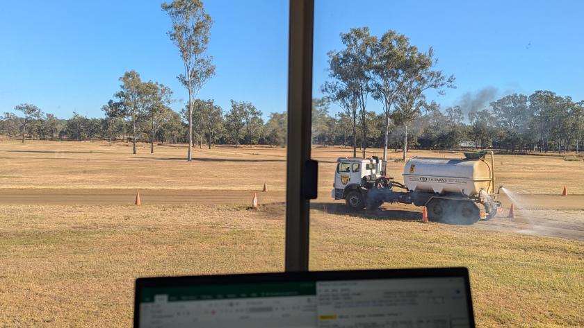 A water truck is keeping dust down at IWMAC - in the foreground you can see a timing laptop